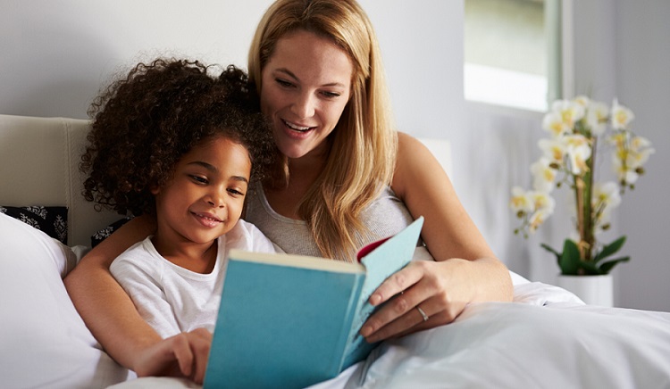mom and daughter reading together